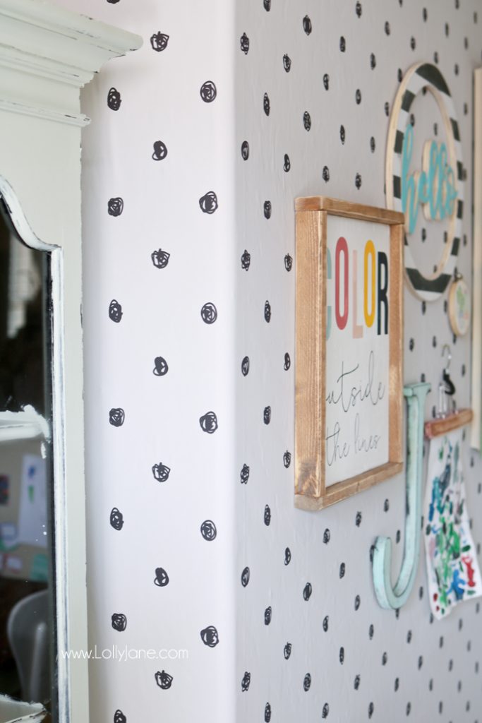 Peel and stick wallpaper can totally transform a space! We love this polka dot wallpaper and how our craft room makeover turned out. Learn the tricks when applying wallpaper, especially tricky corners. #wallpapertips #wallpaperhowto #wallpaperhelp #cornersofwallpaper #peelstickwallpaper