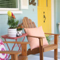 Summer porch decor ideas! Love the pops of coral and bright summer colors! New vases with colorful flowers really brighten up this summer porch! Great summer porch decor ideas!