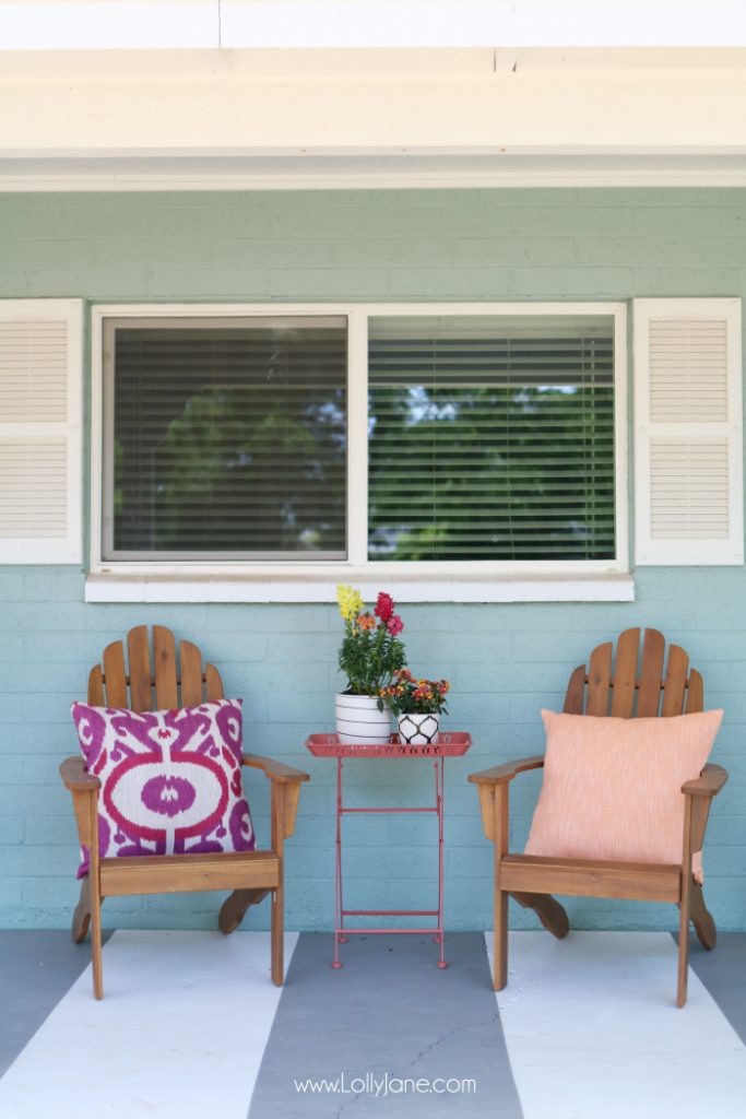 Summer porch decor ideas! Love the pops of coral and bright summer colors! New vases with colorful flowers really brighten up this summer porch! Great summer porch decor ideas!