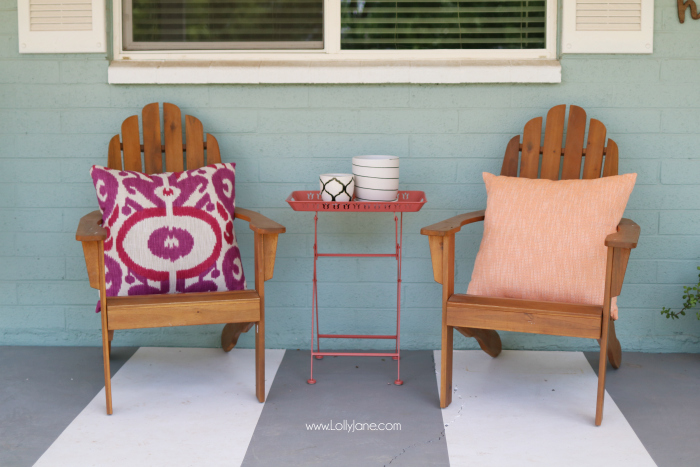 Summer porch decor ideas! Love the pops of coral and bright summer colors! New vases with colorful flowers really brighten up this summer porch! Great summer porch decor ideas!