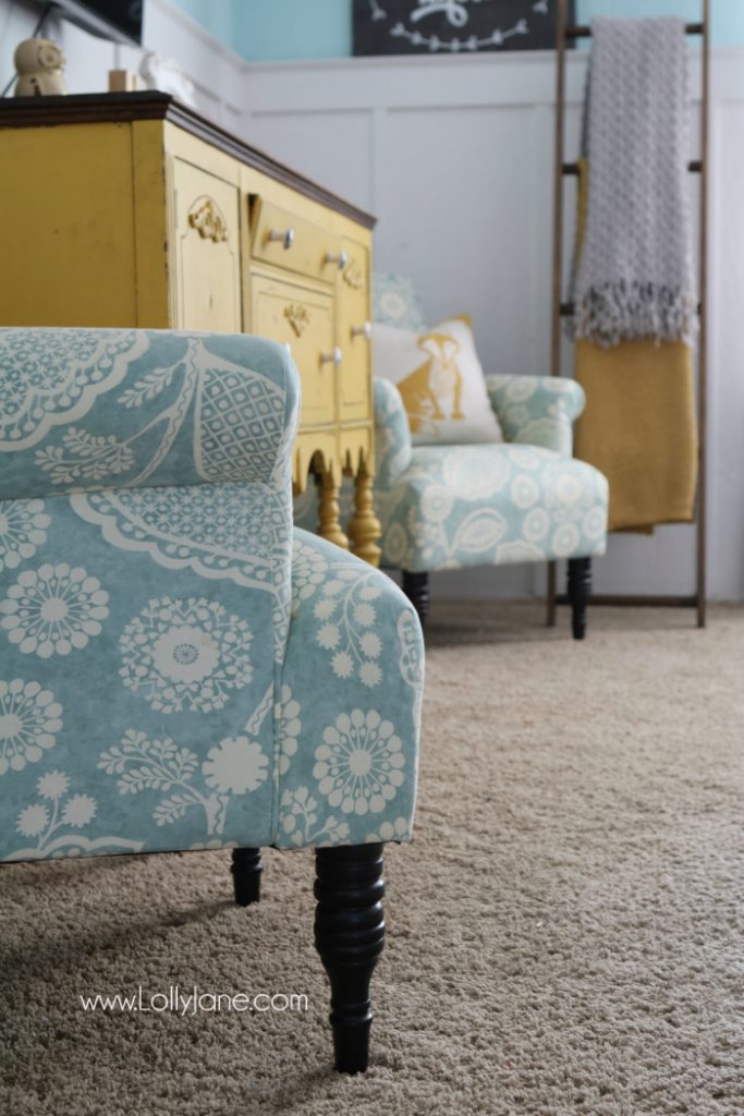 Pretty colorful farmhouse family room decor. Easy ways to pull together a family room space. Pretty farmhouse decor ideas. Love this colorful family room! These billy balls in vintage blue mason jars are such cute decor too. Pretty blue wingback accent chairs complete the space!