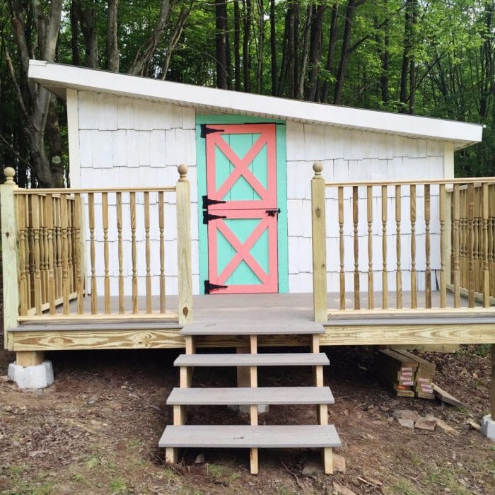 Darling old she shed turned playroom! Love the painted argyle + polka dot patterns! Too cute!