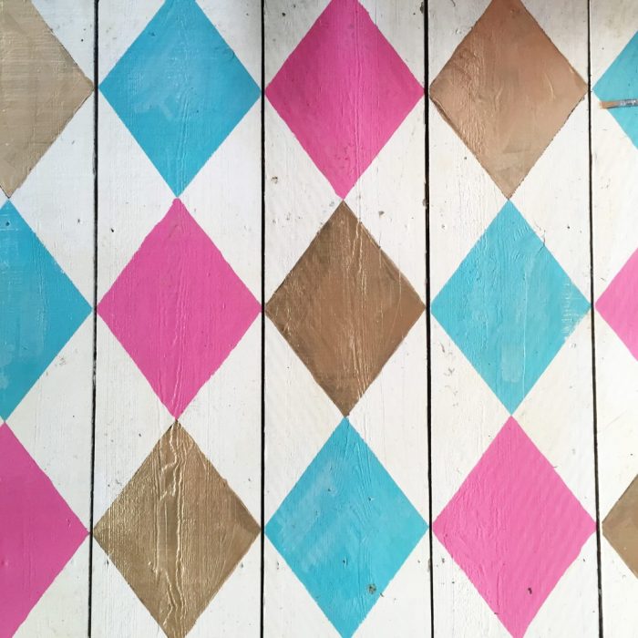 Darling old she shed turned playroom! Love the painted argyle, stripes + polka dot patterns! Too cute!