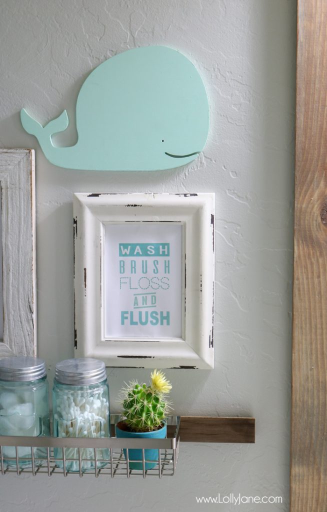 Cute kids bathroom! Refreshed for less than $100 and super organized... love the printable art, too!