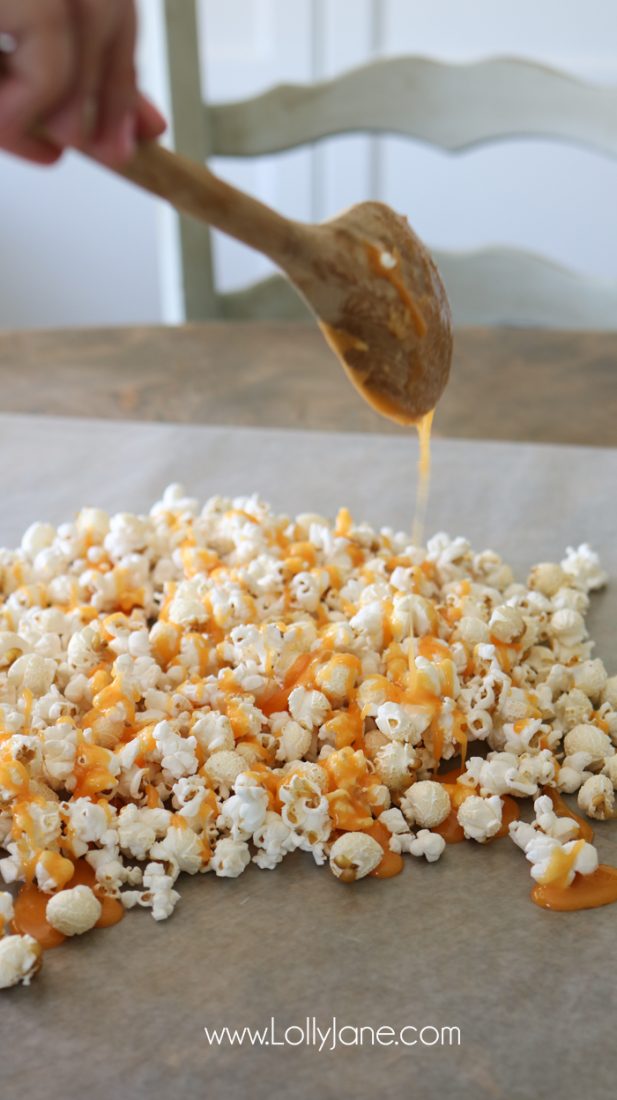 Easy and YUMMY Candy Covered Halloween Popcorn! Perfect for little hands to help in the kitchen, then bag up for a spooky treat!