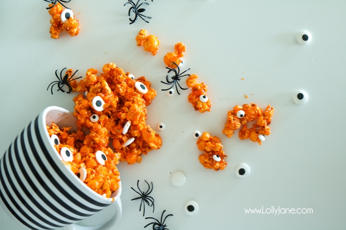 Easy and YUMMY Candy Covered Halloween Popcorn! Perfect for little hands to help in the kitchen, then bag up for a spooky treat!