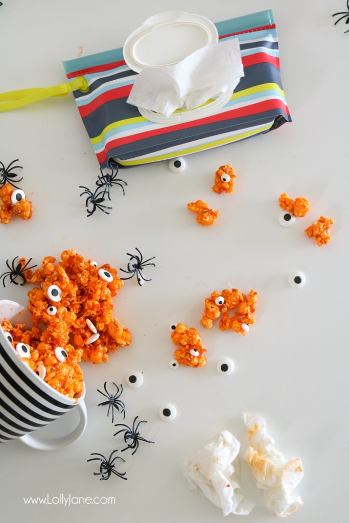 Easy and YUMMY Candy Covered Halloween Popcorn! Perfect for little hands to help in the kitchen, then bag up for a spooky treat!