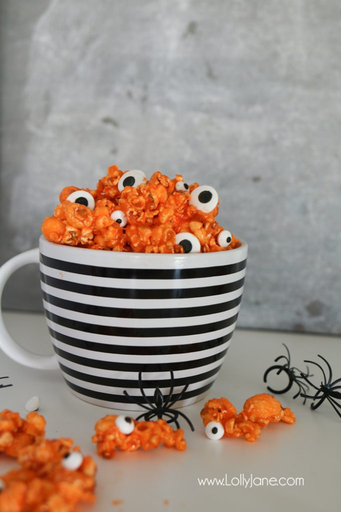 Easy and YUMMY Candy Covered Halloween Popcorn! Perfect for little hands to help in the kitchen, then bag up for a spooky treat!