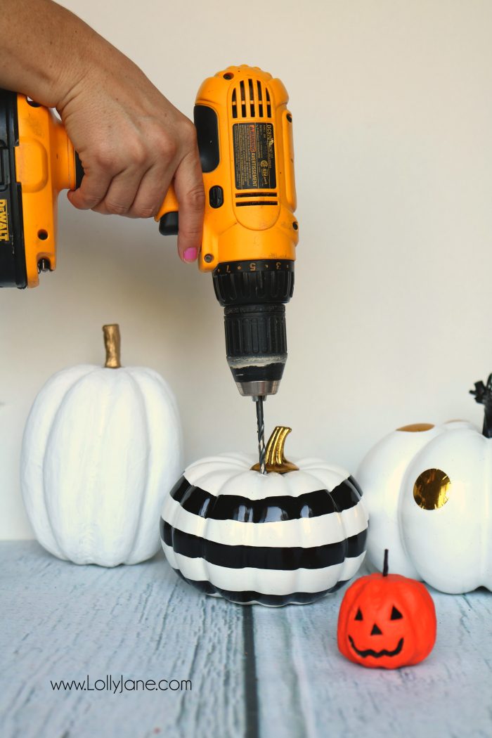 DIY Halloween Pumpkin Succulent Planters. These FAUX pumpkins + succulents are low maintenance and hassle free on your festive mantel or porch! CUTE!!!