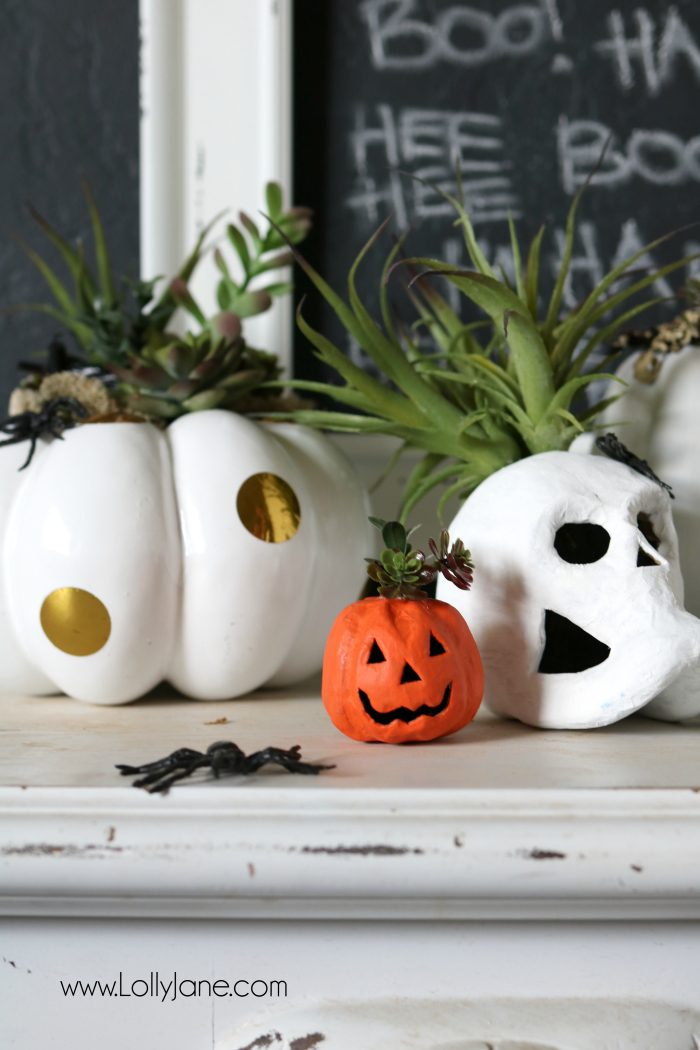 DIY Halloween Pumpkin Succulent Planters. These FAUX pumpkins + succulents are low maintenance and hassle free on your festive mantel or porch! CUTE!!!