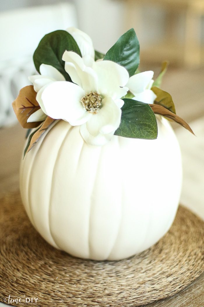 DIY Faux Magnolia Pumpkin | Such a cute fall pumpkin home decor craft! Love this hello fall pumpkin decor! Cute fall decor!