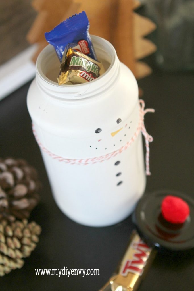 DIY Snowman Candy Jar | Such a cute Christmas craft! Recycle old glass jars into snowman candy jars, cute Christmas gift idea, just fill with candy. Love handmade Christmas gifts!