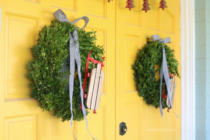 Farmhouse Christmas porch decor. Easy ways to bring a little farmhouse charm to the outdoors. Love the olive buckets and fresh boxwood wreaths.