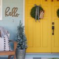 Farmhouse Christmas porch decor. Easy ways to bring a little farmhouse charm to the outdoors. I love those fresh boxwood wreaths!