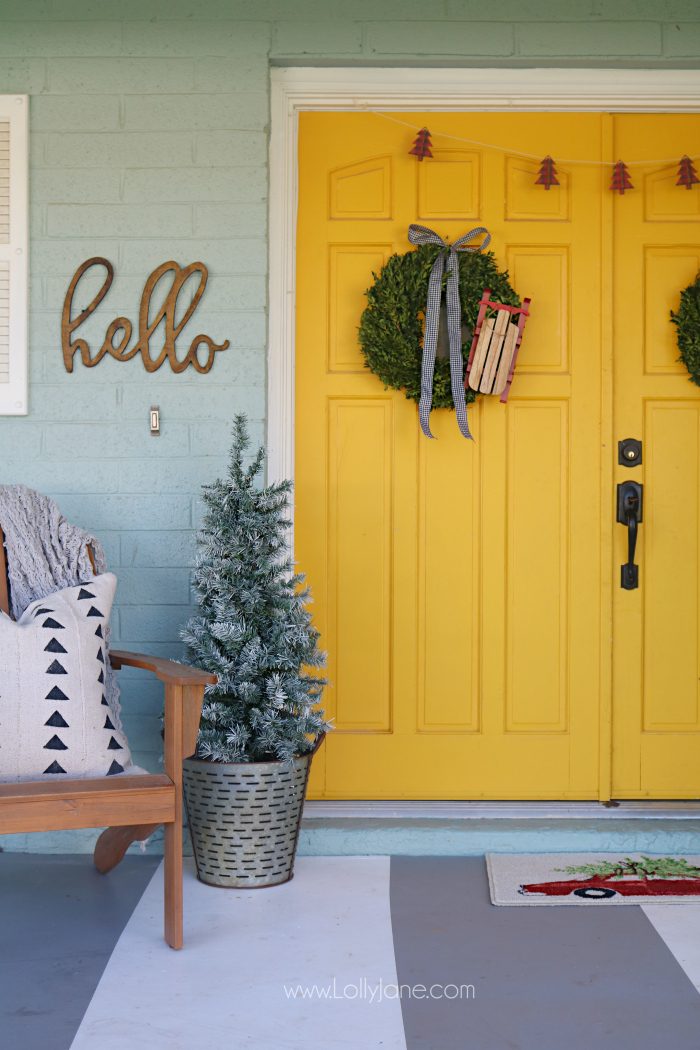 Farmhouse Christmas porch decor. Easy ways to bring a little farmhouse charm to the outdoors. I love those fresh boxwood wreaths!