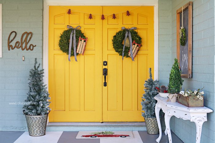 Farmhouse Christmas porch decor. Easy ways to bring a little farmhouse charm to the outdoors. Love the olive buckets and fresh boxwood wreaths.