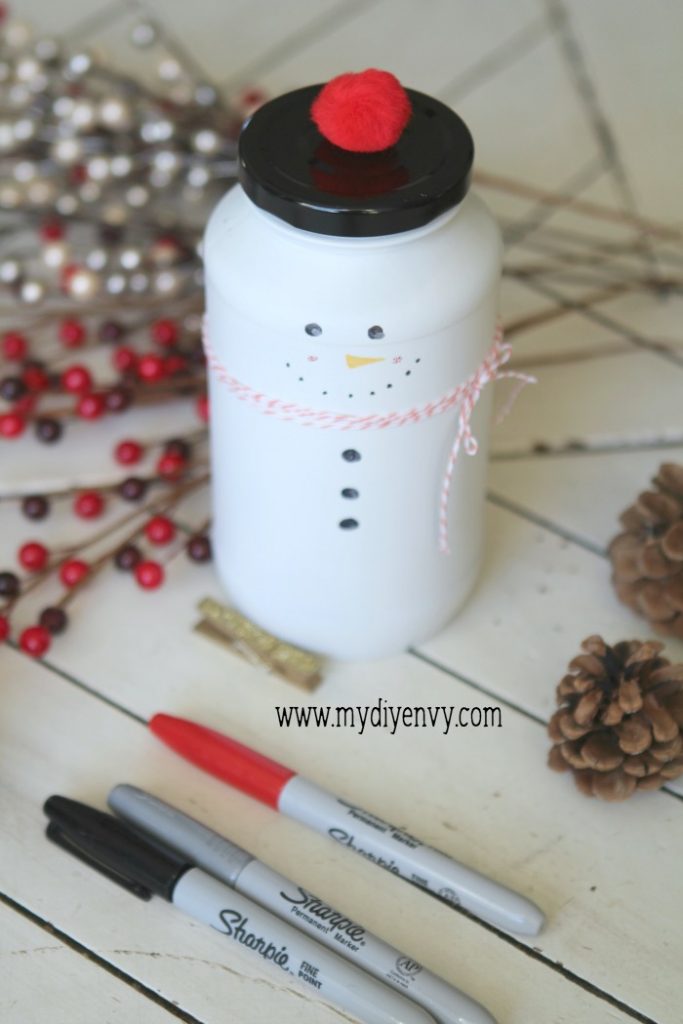 DIY Snowman Candy Jar | Such a cute Christmas craft! Recycle old glass jars into snowman candy jars, cute Christmas gift idea, just fill with candy. Love handmade Christmas gifts!