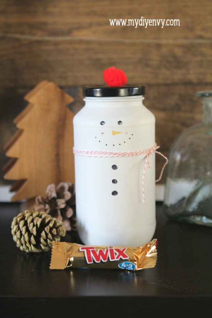 DIY Snowman Candy Jar | Such a cute Christmas craft! Recycle old glass jars into snowman candy jars, cute Christmas gift idea, just fill with candy. Love handmade Christmas gifts!