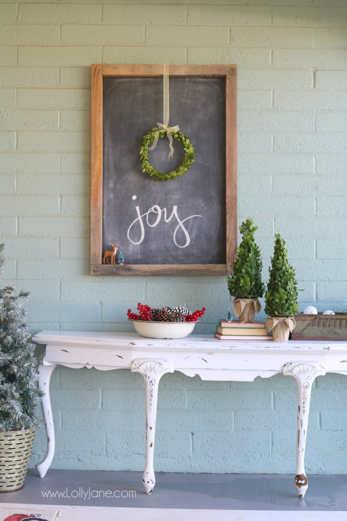 Farmhouse Christmas porch decor. Easy ways to bring a little farmhouse charm to the outdoors. Love the olive buckets and fresh boxwood wreaths.