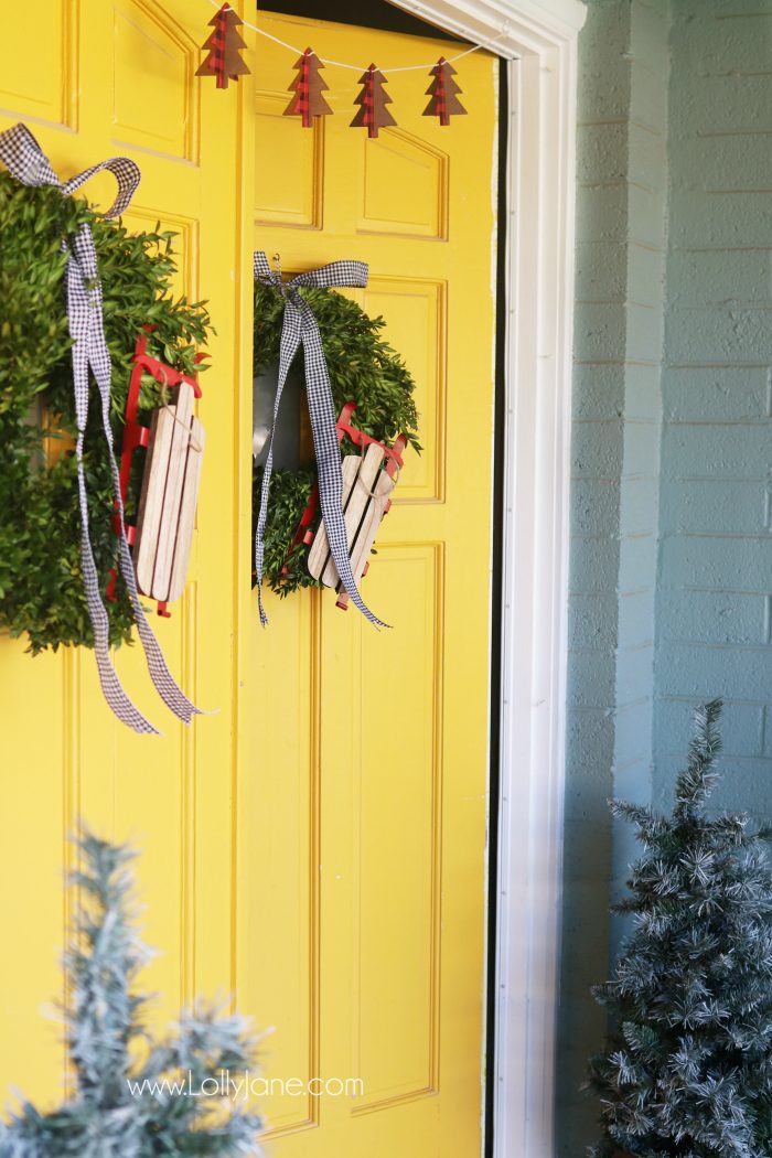 Farmhouse Christmas porch decor. Easy ways to bring a little farmhouse charm to the outdoors. Love the olive buckets and fresh boxwood wreaths.