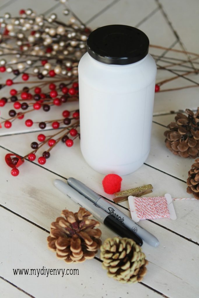 DIY Snowman Candy Jar | Such a cute Christmas craft! Recycle old glass jars into snowman candy jars, cute Christmas gift idea, just fill with candy. Love handmade Christmas gifts!