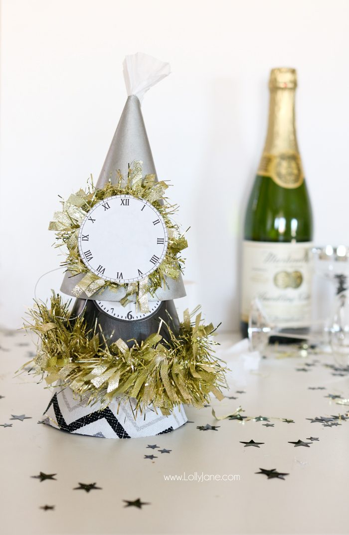 Paint or wrap fabric around dollar store party hats for EASY and cheap glam New Years Eve party gear! Cute!