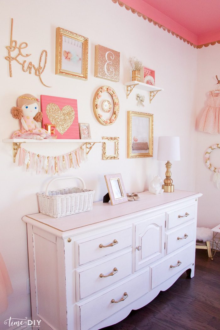 How to create and hang a cute gallery wall, perfect for a girls room or nursery!