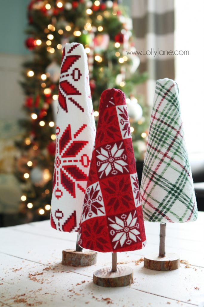 Fun DIY ugly sweater trees craft! These "ugly sweater" trees are cute Christmas decor and make a great centerpiece! Easy Christmas craft idea! Upcycle inexpensive hand towels into Ugly Sweater Christmas trees!