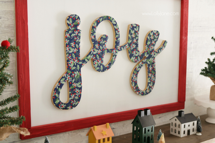 DIY wood cutout sign tutorial. Learn how to cover a wood cutout with paper the proper way then mount to a sign! Such an easy to follow sign tutorial. Love this diy sign. Cute joy sign!