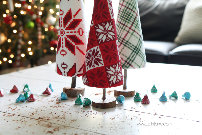 Fun DIY ugly sweater trees craft! These "ugly sweater" trees are cute Christmas decor and make a great centerpiece! Easy Christmas craft idea! Upcycle inexpensive hand towels into Ugly Sweater Christmas trees!