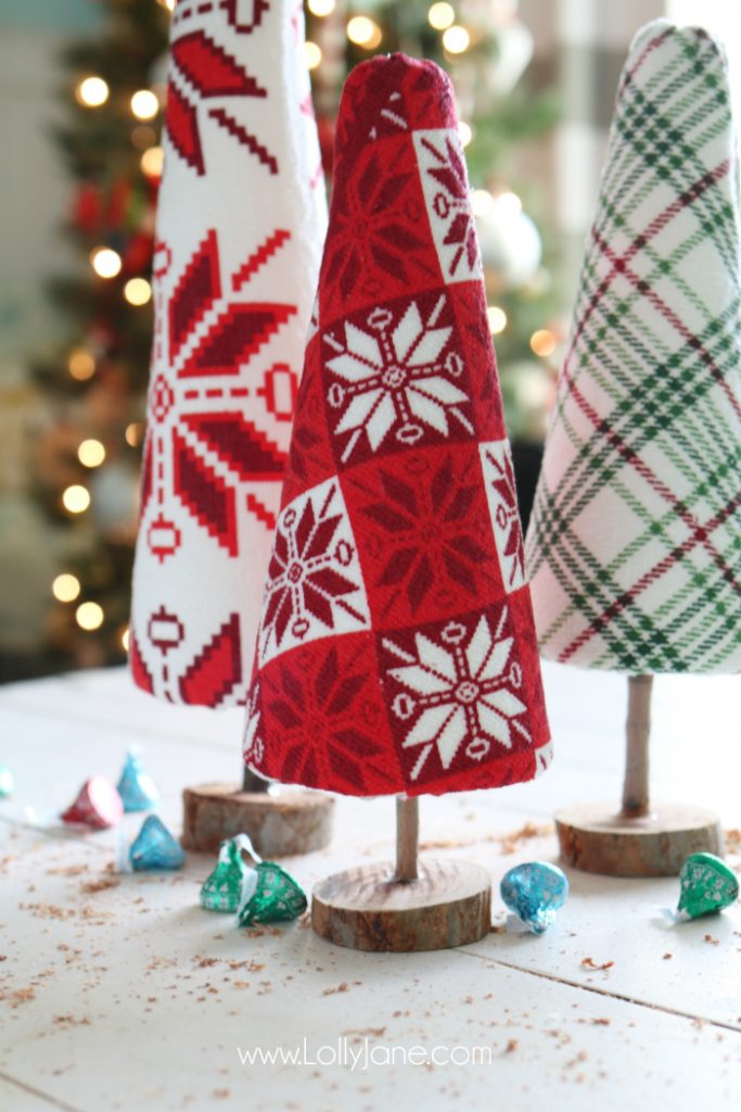 Fun DIY ugly sweater trees craft! These "ugly sweater" trees are cute Christmas decor and make a great centerpiece! Easy Christmas craft idea! Upcycle inexpensive hand towels into Ugly Sweater Christmas trees!