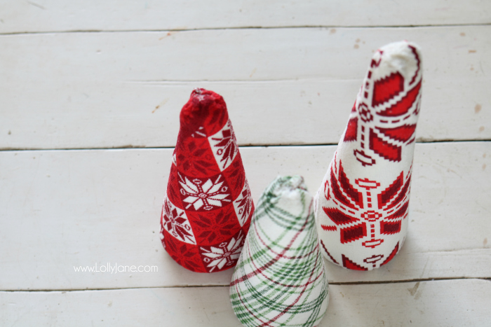 Fun DIY ugly sweater trees craft! These "ugly sweater" trees are cute Christmas decor and make a great centerpiece! Easy Christmas craft idea! Upcycle inexpensive hand towels into Ugly Sweater Christmas trees!