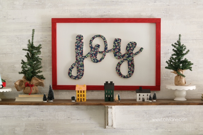 DIY wood cutout sign tutorial. Learn how to cover a wood cutout with paper the proper way then mount to a sign! Such an easy to follow sign tutorial. Love this diy sign. Cute joy sign!