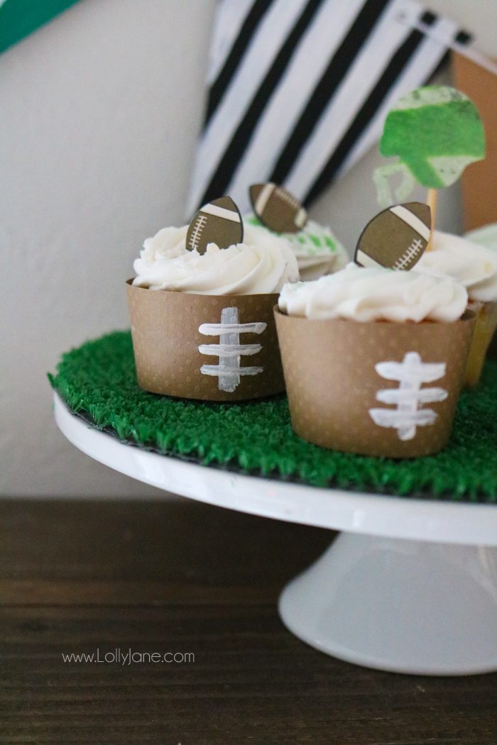 Easy Football decorations to make for Game Day! From football cupcake wrappers to an astro turf cake stand and football pennant, simple crafts you can make with the kids!