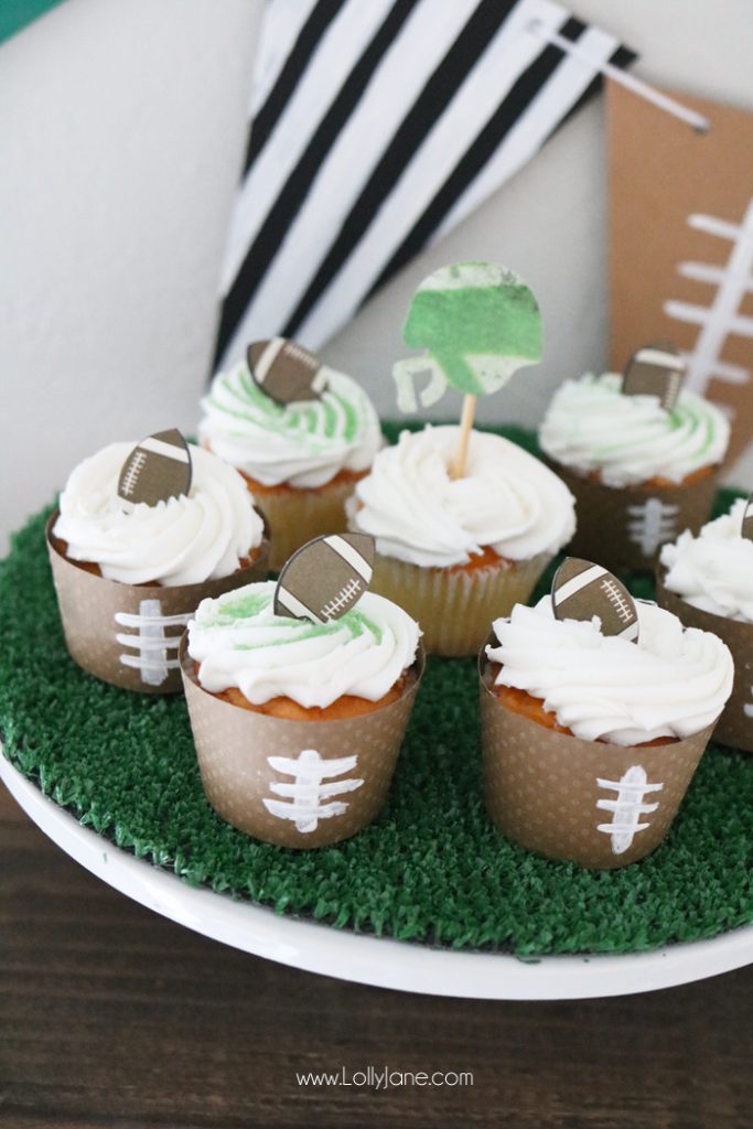 Easy Football decorations to make for Game Day! From football cupcake wrappers to an astro turf cake stand and football pennant, simple crafts you can make with the kids!