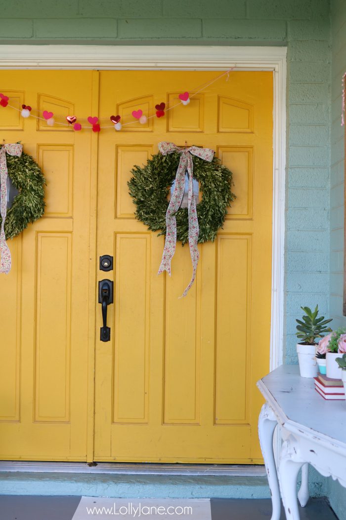 Simple Valentine's Day porch decor. Love this colorful front porch with pops of pink and red for Valentine's Day outdoor decor ideas.