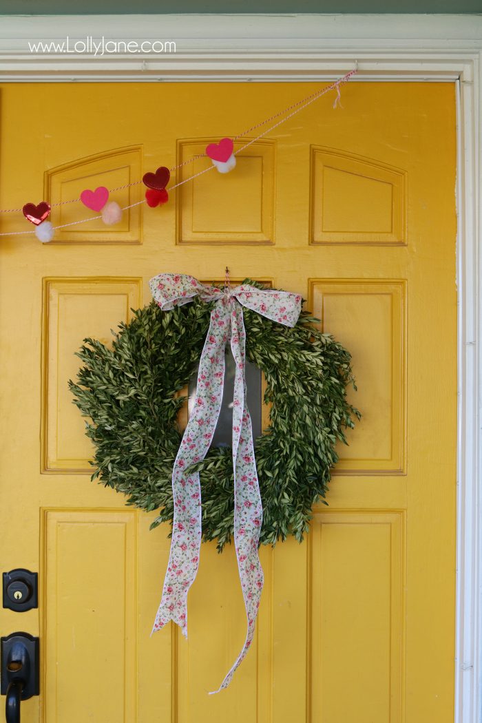 Simple Valentine's Day porch decor. Love this colorful front porch with pops of pink and red for Valentine's Day outdoor decor ideas.