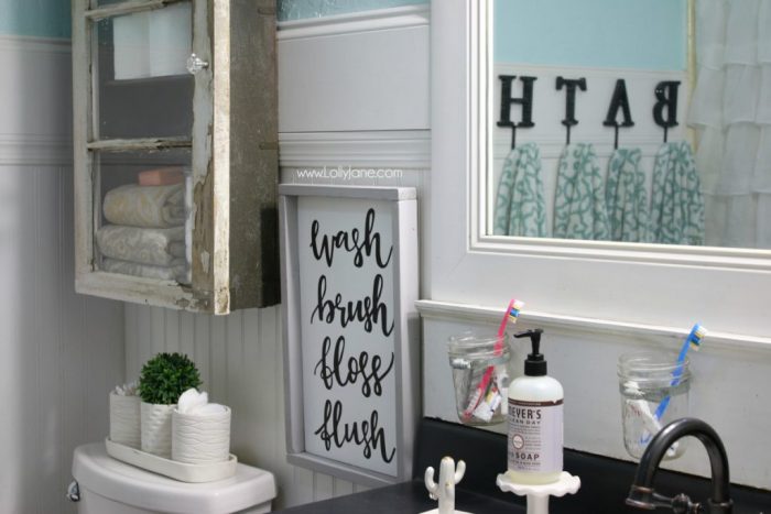 Darling bathroom cabinet diy. Love this rustic farmhouse bathroom. Great cabinet makeover!