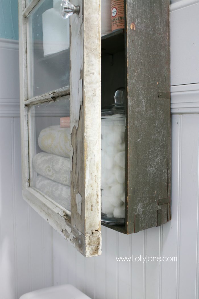 An old trunk and window created this bathroom cabinet!? Such an unreal DIY!