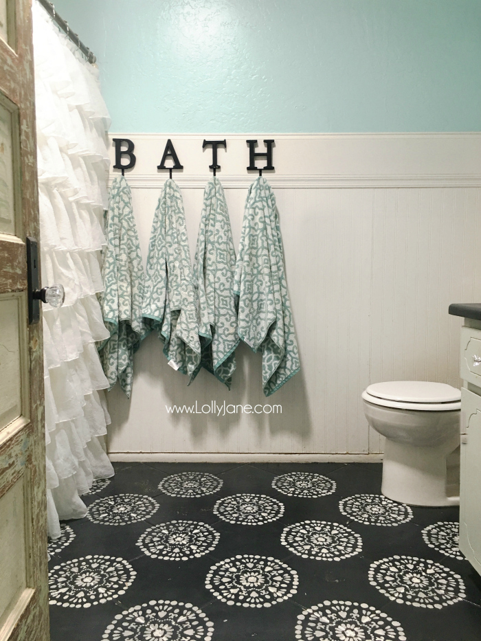 Super affordable bathroom floor makeover solution: how to chalk paint tile floors! So glad I painted my bathroom floors, they look amazing and we spent less than $50! Love this bathroom floor makeover!