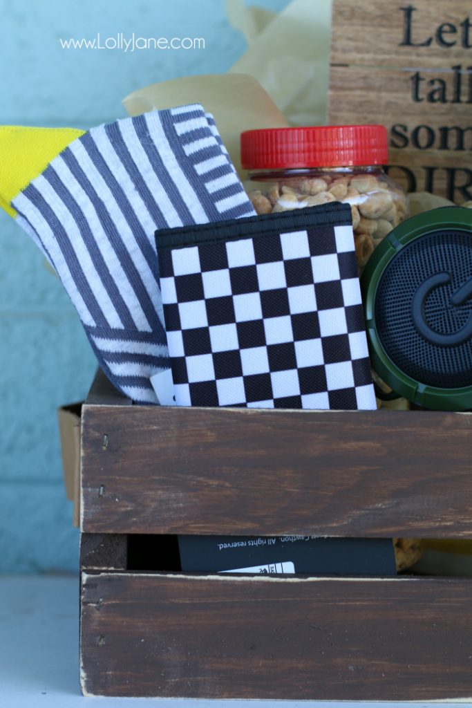 DIY Father's Day gift basket | Grab this premade crate but dress it up with some paint and leather handles. Fill it with your dad's favorite goodies to create the perfect Father's Day gift! Love this DIY Fathers Day gift basket!