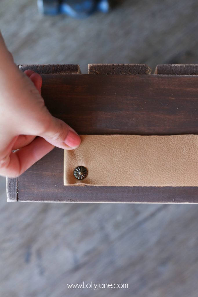 DIY Father's Day gift basket | Grab this premade crate but dress it up with some paint and leather handles. Fill it with your dad's favorite goodies to create the perfect Father's Day gift! Love this DIY Fathers Day gift basket!