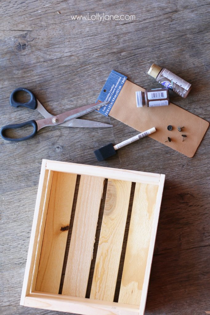 DIY Father's Day gift basket | Grab this premade crate but dress it up with some paint and leather handles. Fill it with your dad's favorite goodies to create the perfect Father's Day gift! Love this DIY Fathers Day gift basket!