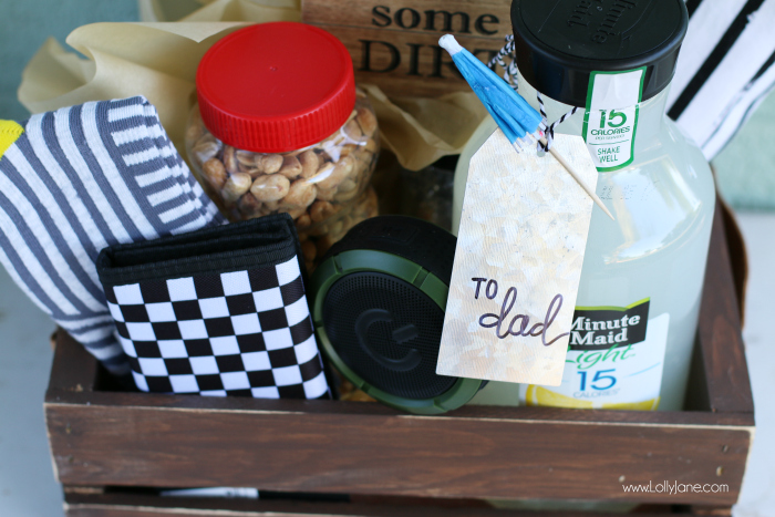 DIY Father's Day gift basket | Grab this premade crate but dress it up with some paint and leather handles. Fill it with your dad's favorite goodies to create the perfect Father's Day gift! Love this DIY Fathers Day gift basket!