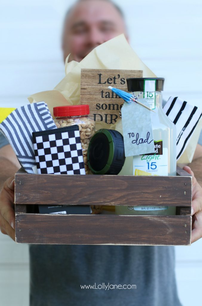 DIY Father's Day gift basket | Grab this premade crate but dress it up with some paint and leather handles. Fill it with your dad's favorite goodies to create the perfect Father's Day gift! Love this DIY Fathers Day gift basket!