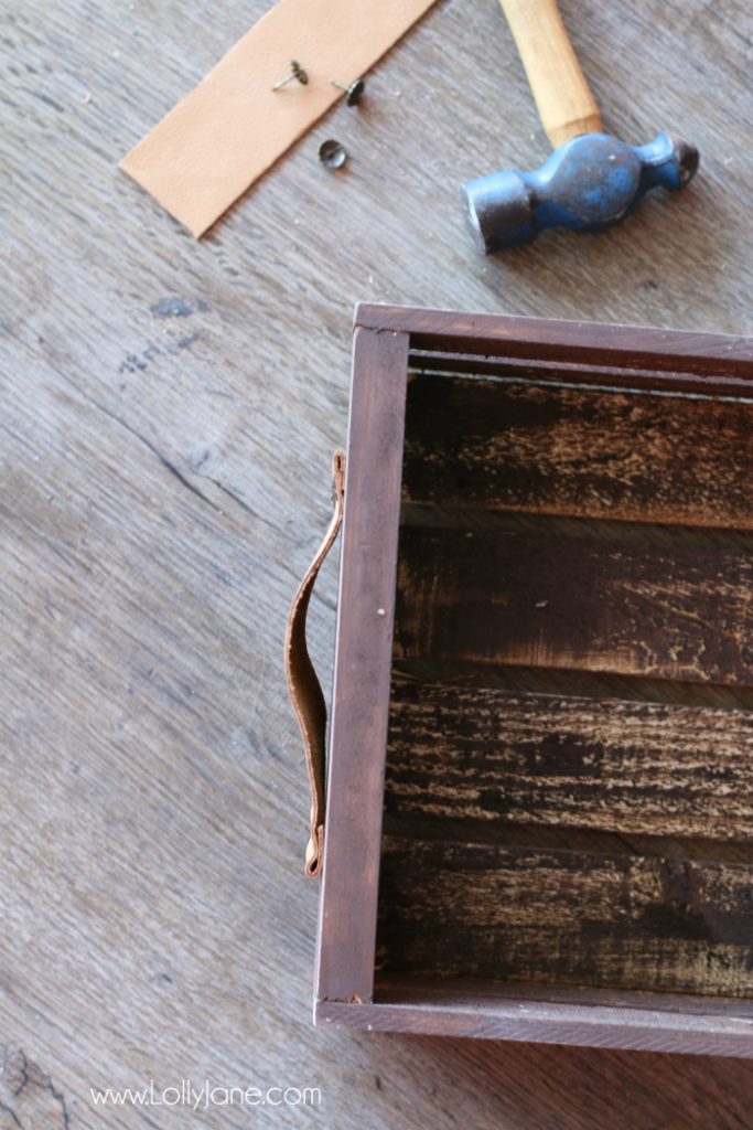 DIY Father's Day gift basket | Grab this premade crate but dress it up with some paint and leather handles. Fill it with your dad's favorite goodies to create the perfect Father's Day gift! Love this DIY Fathers Day gift basket!