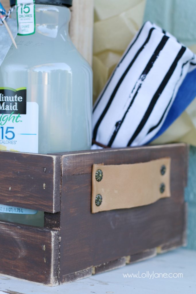 DIY Father's Day gift basket | Grab this premade crate but dress it up with some paint and leather handles. Fill it with your dad's favorite goodies to create the perfect Father's Day gift! Love this DIY Fathers Day gift basket!