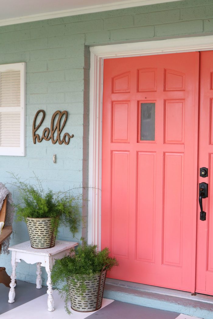 Loving these bright front doors! So easy to make a statement with bold front door paint choices using @decoart's Curb Appeal paint. Such cheery front doors on a colorful porch. Cute outdoor decor ideas!