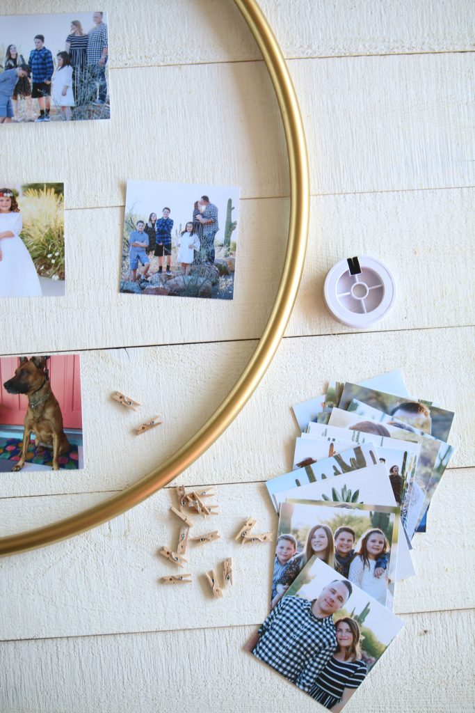 DIY Hula Hoop Photo Display | Check out this easy hula hoop photo display idea! Such a creative way to display pictures with unique items!