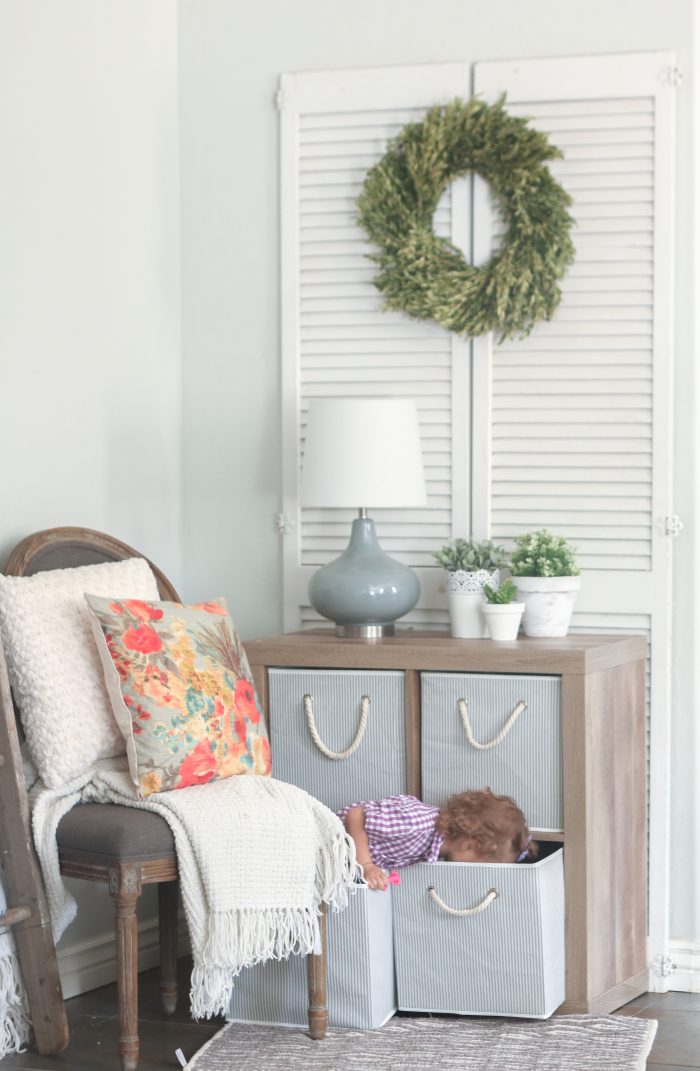 Striped totes + canvas in a stylish cube organizer to hide toys = mom win! Love this refreshed chic space!